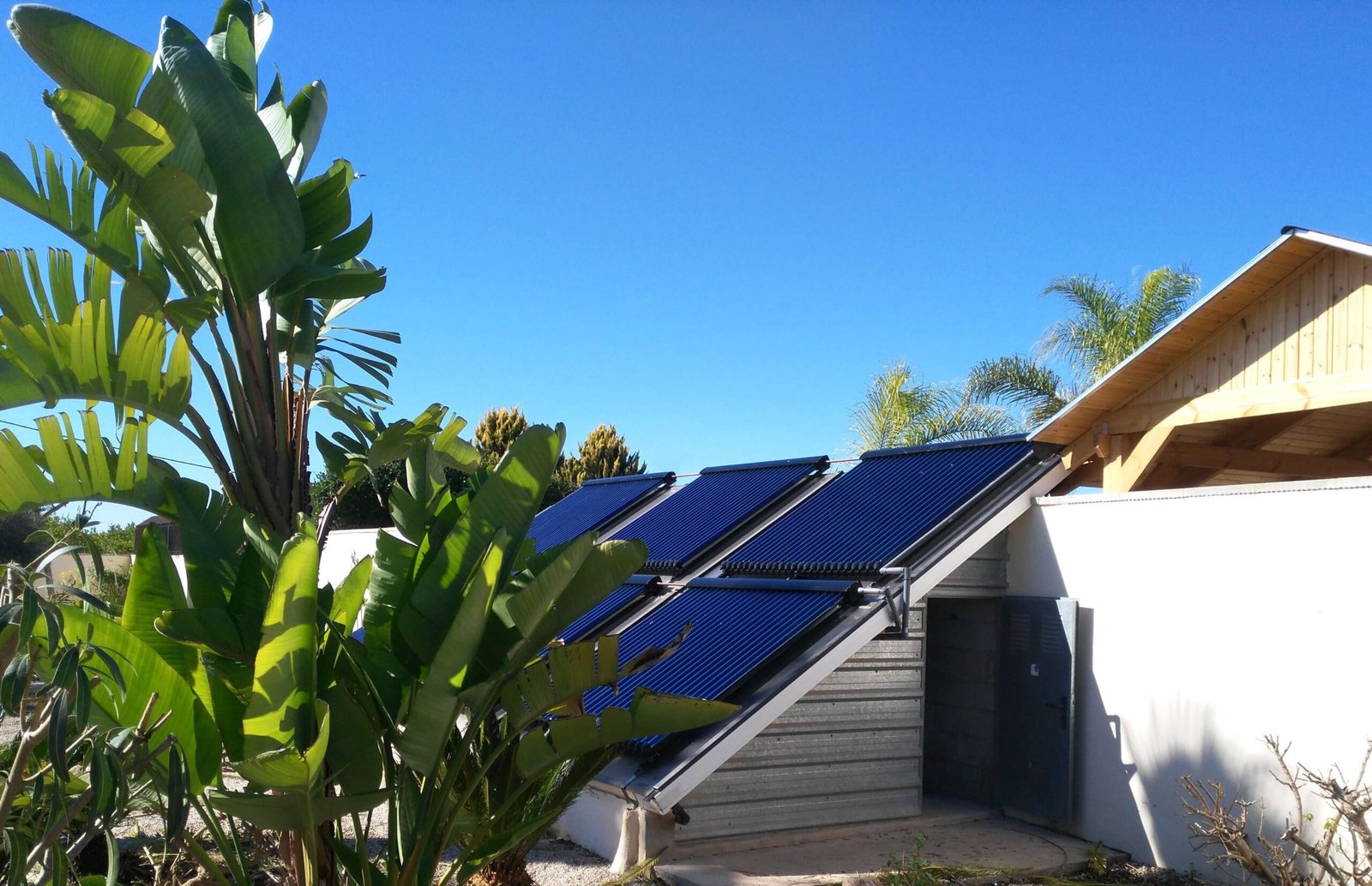Modern home with rooftop solar panels for heating system